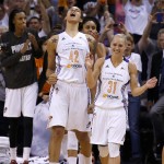  Phoenix Mercury's Brittney Griner (42) celebrates the impending win with teammates Erin Phillips (31) and DeWanna Bonner, left, during the second half of Game 3 in the WNBA Western Conference basketball finals against the Minnesota Lynx on Tuesday, Sept. 2, 2014, in Phoenix. The Mercury defeated the Lynx 96-78, winning the series and advancing to the WNBA Finals. (AP Photo/Ross D. Franklin)