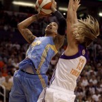 Chicago Sky forward Tamera Young (1) drives on Phoenix Mercury forward Penny Taylor (13) in the second half of Game 1 of the WNBA basketball finals, Sunday, Sept. 7, 2014, in Phoenix. The Mercury defeated the Sky 83-62. (AP Photo/Rick Scuteri)