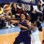 Phoenix Mercury forward Candice Dupree shoots between Chicago Sky center Sylvia Fowles, back left, and forward Tamera Young during the second half of Game 3 of the WNBA Finals basketball series, Friday, Sept. 12, 2014, in Chicago. The Mercury won 87-82 to sweep the series. (AP Photo/Matt Marton)