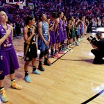 West team players line up during the national anthem before the WNBA All-Star basketball game, Saturday, July 19, 2014, in Phoenix. (AP Photo/Matt York)