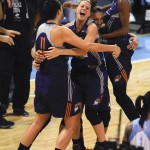 Phoenix Mercury's Diana Taurasi, center right, and Penny Taylor, center left, celebrate with teammates after the Mercury won the WNBA basketball title, defeating the Chicago Sky 87-82 in Game 3 of the WNBA Finals on Friday, Sept. 12, 2014, in Chicago. (AP Photo/Matt Marton)