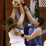  Minnesota Lynx's Janel McCarville, right, blocks the shot of Phoenix Mercury's Brittney Griner during the first half of Game 3 in the WNBA Western Conference basketball finals Tuesday, Sept. 2, 2014, in Phoenix. (AP Photo/Ross D. Franklin)