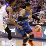  Phoenix Mercury's DeWanna Bonner, left, slaps the ball away from Minnesota Lynx's Maya Moore during the first half of Game 3 in the WNBA Western Conference basketball finals Tuesday, Sept. 2, 2014, in Phoenix. (AP Photo/Ross D. Franklin)