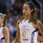 Phoenix Mercury center Brittney Griner (42) walks to the bench after getting a cut above her eye during the first half of Game 2 of the WNBA basketball finals against the Chicago Sky, Tuesday, Sept. 9, 2014, in Phoenix. (AP Photo/Matt York)