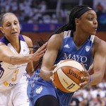 Minnesota Lynx's Monica Wright, right, drives past Phoenix Mercury's Diana Taurasi (3) during the first half in Game 1 of the WNBA Western Conference Finals basketball game, Friday, Aug. 29, 2014, in Phoenix. (AP Photo/Ross D. Franklin)