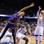 Phoenix Mercury's Mistie Bass (8) fights for a rebound with Connecticut Sun's Renee Montgomery (21) and Katie Douglas (23) during the first half of their WNBA basketball game in Uncasville, Conn., Thursday, June 12, 2014. (AP Photo/Fred Beckham)