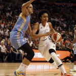 Phoenix Mercury forward Candice Dupree (4) drives on Chicago Sky forward Elena Delle Donne (11) in the first half of Game 1 of the WNBA basketball finals, Sunday, Sept. 7, 2014, in Phoenix. (AP Photo/Rick Scuteri)