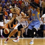 Phoenix Mercury forward Penny Taylor (13) drives on Chicago Sky forward Tamera Young (1) in the first half of Game 1 of the WNBA basketball finals, Sunday, Sept. 7, 2014, in Phoenix. (AP Photo/Rick Scuteri)