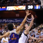 Phoenix Mercury's Candice Dupree (4) guards Connecticut Sun's Kelsey Griffin (5) during the first half of their WNBA basketball game in Uncasville, Conn., Thursday, June 12, 2014. (AP Photo/Fred Beckham)