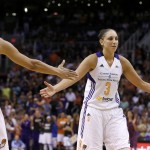 Phoenix Mercury's Diana Taurasi (3) slaps hands with Candice Dupree (4) after Taurasi made a foul shot during the second half in Game 1 of the WNBA basketball Western Conference semifinals against the Los Angeles Sparks on Friday, Aug. 22, 2014, in Phoenix. The Mercury defeated the Sparks 75-72. (AP Photo/Ross D. Franklin)
