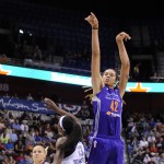 Phoenix Mercury's Brittney Griner (42) shoots over Connecticut Sun's Chiney Ogwumike (13) during the first half of a WNBA basketball game in Uncasville, Conn., Thursday, June 12, 2014. (AP Photo/Fred Beckham)