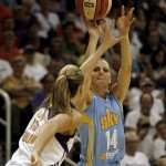 Chicago Sky guard Allie Quigley (14) shoots over Phoenix Mercury forward Penny Taylor (13) in the second half of Game 1 of the WNBA basketball finals, Sunday, Sept. 7, 2014, in Phoenix. The Mercury defeated the Sky 83-62. (AP Photo/Rick Scuteri)