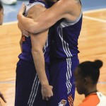 Phoenix Mercury's Ewelina Kobryn, right, hugs Diana Taurasi after she scored a basket against the Chicago Sky near the end of Game 3 of the WNBA Finals basketball series, Friday, Sept. 12, 2014, in Chicago. The Mercury won 87-82 to take the WNBA title. (AP Photo/Matt Marton)