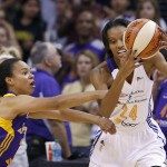 Phoenix Mercury's DeWanna Bonner (24) tries to keep the ball away from Los Angeles Sparks' Kristi Toliver, left, during the first half in Game 1 of the WNBA basketball Western Conference semifinals Friday, Aug. 22, 2014, in Phoenix. (AP Photo/Ross D. Franklin)