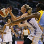 Phoenix Mercury forward Penny Taylor loses the ball as Chicago Sky center Sylvia Fowles (34) defends during the first half of Game 2 of the WNBA basketball finals against the Phoenix Mercury Chicago Sky, Tuesday, Sept. 9, 2014, in Phoenix. (AP Photo/Matt York)