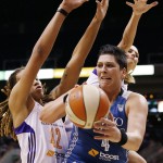  Minnesota Lynx's Janel McCarville, right, tries to get off a pass as Phoenix Mercury's Brittney Griner (42) and Penny Taylor, of Australia, defend during the first half of Game 3 in the WNBA Western Conference basketball finals Tuesday, Sept. 2, 2014, in Phoenix. (AP Photo/Ross D. Franklin)