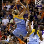 Chicago Sky's Elena Delle Donne (11) scores over Phoenix Mercury's Candice Dupree as the Sky's Michelle Campbell (25) looks on in the first half during a WNBA basketball game on Monday, May 27, 2013, in Phoenix. (AP Photo/Ross D. Franklin)
