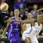 Seattle Storm's Ashley Robinson, right, and Phoenix Mercury's Candice Dupree watch a loose ball in the first half of a WNBA basketball game on Thursday, Aug. 1, 2013, in Seattle. (AP Photo/Elaine Thompson)