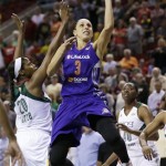 Phoenix Mercury's Diana Taurasi (3) drives the lane between Seattle Storm's Camille Little, left, and Shekinna Stricklen in the first half of a WNBA basketball game on Thursday, Aug. 1, 2013, in Seattle. (AP Photo/Elaine Thompson)