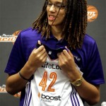 Phoenix Mercury's Brittney Griner, the No. 1 overall pick the WNBA draft, holds a team jersey during a news conference Saturday, April 20, 2013, in Phoenix. (AP Photo/Matt York)
