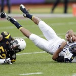 Navy quarterback Keenan Reynolds, right, is sacked by Arizona State linebacker Carl Bradford (52) during the first half of the Fight Hunger Bowl NCAA college football game in San Francisco, Saturday, Dec. 29, 2012. (AP Photo/Marcio Jose Sanchez)
