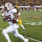 Stanford's Tyler Gaffney (25) runs for a touchdown as he gets past Arizona State's Damarious Randall as Stanford's Michael Rector (3) looks on from behind during the first half of the NCAA Pac-12 Championship football game Saturday, Dec. 7, 2013, in Tempe, Ariz. (AP Photo/Ross D. Franklin)
