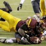 Arizona State's Marion Grice, front, dives for the end zone but is stopped short by Colorado's Chidobe Awuzie during the first half of an NCAA college football game on Saturday Oct. 12, 2013, in Tempe, Ariz. (AP Photo/Ross D. Franklin)