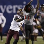 Texas Tech wide receiver Jakeem Grant (11) can't hold on to a pass as Arizona State defensive back Damarious Randall, left, defends during the second half of the Holiday Bowl NCAA college football game Monday, Dec. 30, 2013, in San Diego. (AP Photo/Gregory Bull)
