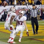 Stanford wide receiver Ty Montgomery (7) celebrates his touchdown with teammate Jordan Pratt (87) during the second half of the NCAA Pac-12 Championship football game against Arizona State, Saturday, Dec. 7, 2013, in Tempe, Ariz. Stanford won 38-14.(AP Photo/Matt York)