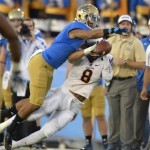 UCLA defensive back Priest Willis, left, knocks down a pass intended for Arizona State running back D.J. Foster during the first half an NCAA college football game, Saturday, Nov. 23, 2013, in Pasadena, Calif. (AP Photo/Mark J. Terrill)