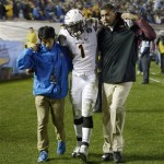 ASU running back Marion Grice is helped to the locker room after being injured during the second half an NCAA college football game against UCLA, Saturday, Nov. 23, 2013, in Pasadena, Calif. (AP Photo/Mark J. Terrill)