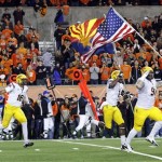 Arizona State players run onto the field carrying the United States flag and the Arizona state flag before their NCAA college football game against Oregon State in Corvallis, Ore., Saturday, Nov. 3, 2012. (AP Photo/Don Ryan)