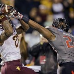 Arizona State wide receiver Jaelen Strong pulls in an apparent touchdown pass over Texas Tech defensive back Bruce Jones during the first half of the Holiday Bowl NCAA college football game Monday, Dec. 30, 2013, in San Diego. Strong was called for offensive pass interference on the play. (AP Photo/Lenny Ignelzi)