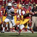 Southern California wide receiver Marqise Lee (9) makes a catch and runs for an 80-yard touchdown past Arizona State cornerback Deveron Carr (1) during the first half of an NCAA college football game, Saturday, Nov. 10, 2012, in Los Angeles. (AP Photo/Bret Hartman)
