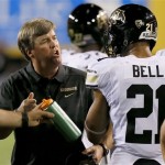 Colorado head coach Mike MacIntyre, left, yells at Jered Bell (21) after the defense gives up an early touchdown to Arizona State during the first half of an NCAA college football game on Saturday Oct. 12, 2013, in Tempe, Ariz. (AP Photo/Ross D. Franklin)
