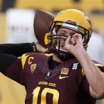 Arizona State's Taylor Kelly throws a pass as he warms up before an NCAA college football game against Sacramento State on Thursday, Sept. 5, 2013, in Tempe, Ariz. (AP Photo/Ross D. Franklin)