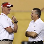 Arizona State head coach Todd Graham, right, talks with Wisconsin head coach Gary Andersen prior to an NCAA college football game on Saturday, Sept. 14, 2013, in Phoenix. (AP Photo/Ross D. Franklin)