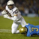 Arizona State running back D.J. Foster, left, is tackled by UCLA safety Randall Goforth during the second half an NCAA college football game, Saturday, Nov. 23, 2013, in Pasadena, Calif. (AP Photo/Mark J. Terrill)