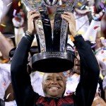 Stanford head coach David Shaw holds up the Pac-12 Championship Trophy after the NCAA Pac-12 Championship football game win against Arizona State Saturday, Dec. 7, 2013, in Tempe, Ariz. Stanford defeated Arizona State 38-14. (AP Photo/Ross D. Franklin)