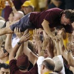 Arizona State fans celebrate a touchdown during the first half in an NCAA college football game against the Sacramento State on Thursday, Sept. 5, 2013, in Tempe, Ariz. (AP Photo/Ross D. Franklin)