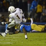 Arizona State running back Marion Grice, left, is tackled by UCLA cornerback Ishmael Adams during the second half an NCAA college football game, Saturday, Nov. 23, 2013, in Pasadena, Calif. (AP Photo/Mark J. Terrill)