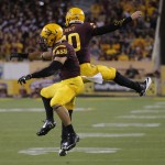 Arizona State running back D.J. Foster, left, celebrates with Taylor Kelly during the second half of an NCAA college football game against Weber State, Thursday, Aug. 28, 2014, in Tempe, Ariz. (AP Photo/Matt York)