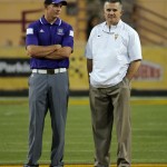 Weber State coach Jay Hill, left, and Arizona State coach Todd Graham watch players warm up for an NCAA college football game Thursday, Aug. 28, 2014, in Tempe, Ariz. (AP Photo/Matt York)