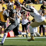 Arizona State wide receiver Cameron Smith (6) makes a catch for a touchdown as Notre Dame cornerback Devin Butler defends during the first half of an NCAA college football game, Saturday, Nov. 8, 2014, in Tempe, Ariz. (AP Photo/Matt York)