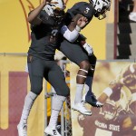 Arizona State defensive back Damarious Randall (3) celebrate his interception for a touchdown with teammate Colton Gerhart during the first half of an NCAA college football game against Notre Dame, Saturday, Nov. 8, 2014, in Tempe, Ariz. (AP Photo/Matt York)