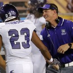 Weber State coach Jay Hill greets Tre'von Johnson after a play against Arizona State during the first half of an NCAA college football game, Thursday, Aug. 28, 2014, in Tempe, Ariz. (AP Photo/Matt York)