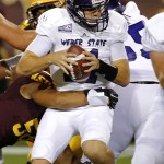 Weber State quarterback Billy Green is sacked by Arizona State linebacker Salamo Fiso during the first half of an NCAA college football game, Thursday, Aug. 28, 2014, in Tempe, Ariz. (AP Photo/Matt York)