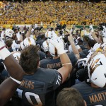 Arizona State players salute their fans after their 55-31 win over Notre Dame in an NCAA college football game against Notre Dame, Saturday, Nov. 8, 2014, in Tempe, Ariz. (AP Photo/Matt York)