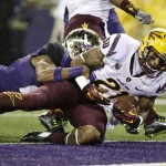 Arizona State's Jaelen Strong, right, scores in front of Washington's Marcus Peters during the first half of an NCAA college football game Saturday, Oct. 25, 2014, in Seattle. (AP Photo/Elaine Thompson)