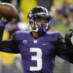 Washington quarterback Troy Williams drops back to pass against Arizona State during the first half of an NCAA college football game Saturday, Oct. 25, 2014, in Seattle. (AP Photo/Elaine Thompson)